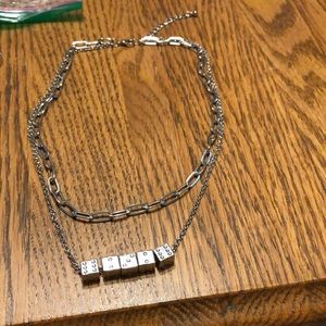 Silver tone double necklace with dice